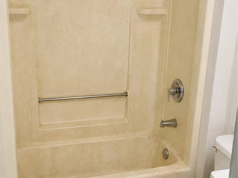 Chalky crazed fiberglass tub-shower combo in a Centerville apartment before refinishing, Fremont