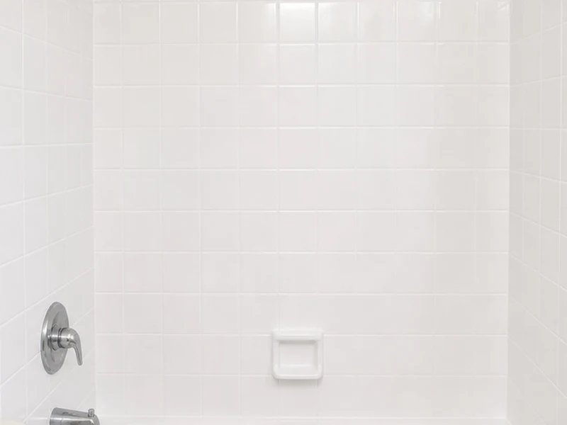 Same Niles shower tile reglazed to clean white with sealed grout lines, Fremont