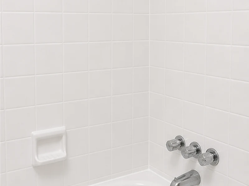 Same Niles tub-surround tile reglazed clean white with sealed grout after reglazing, Fremont