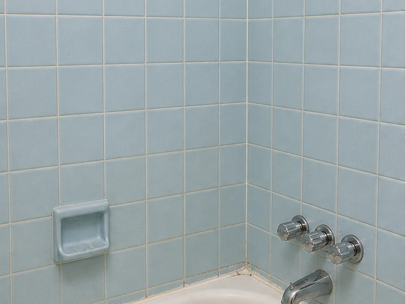 Dated powder-blue 4-inch wall tile with discolored grout in a Niles home before reglazing, Fremont